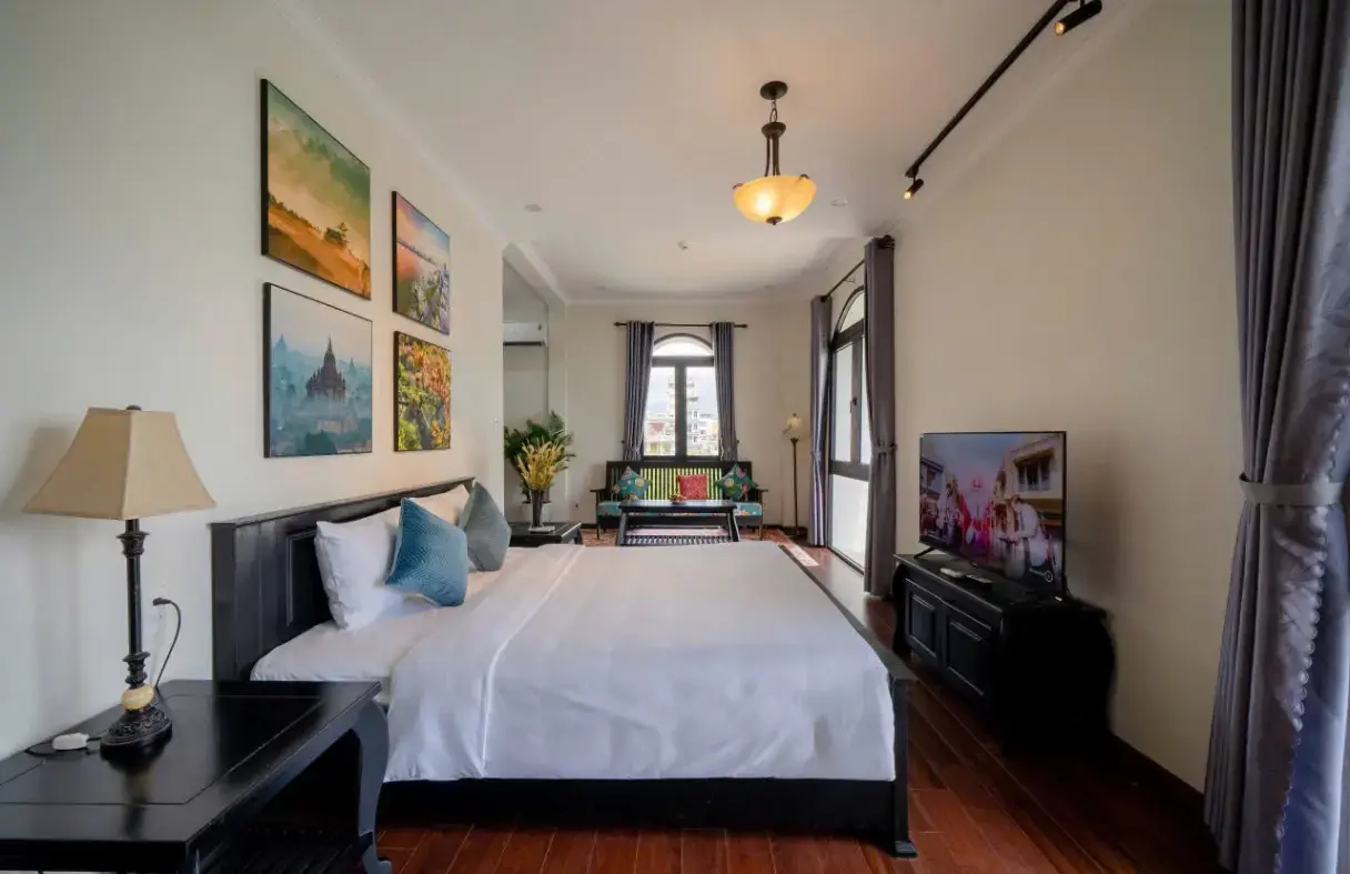 Classic-style bedroom in a Da Nang villa designed for comfort, warmth, and long stays