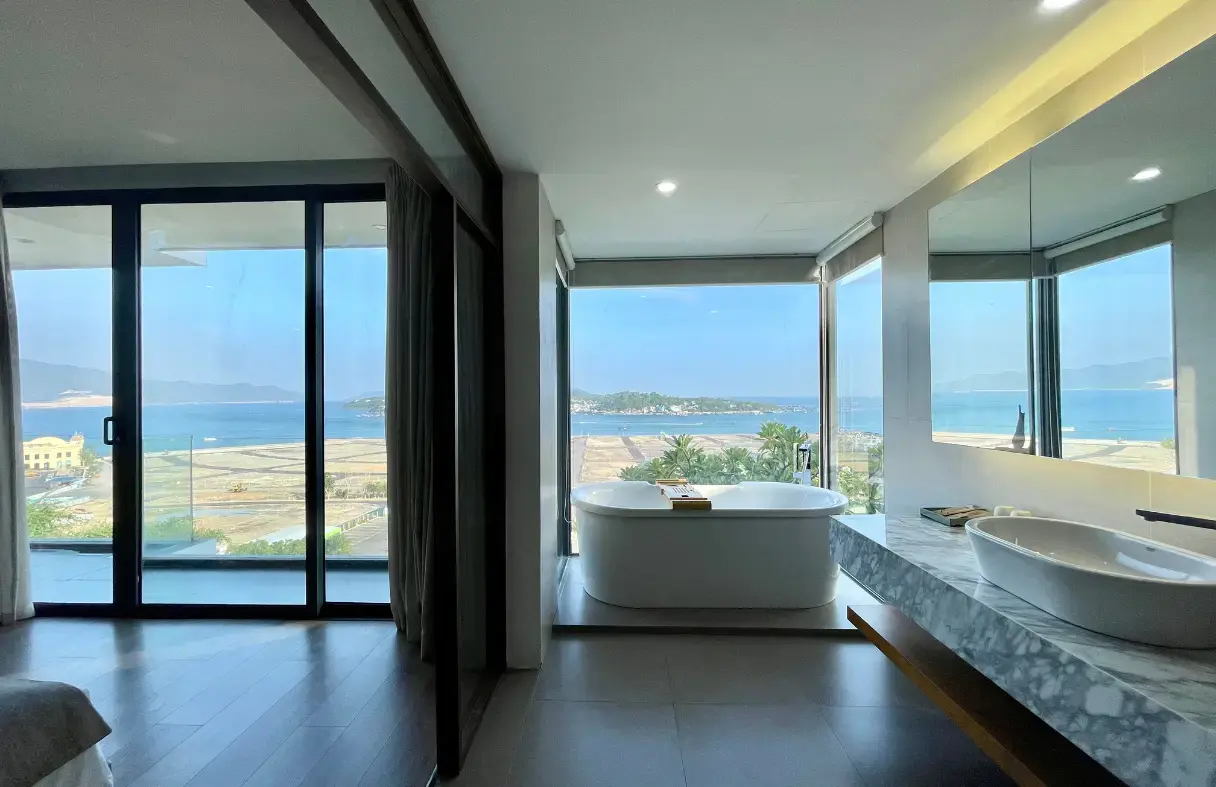 Serene Da Nang luxury villa with an infinity pool overlooking the peaceful river and lush natural surroundings.