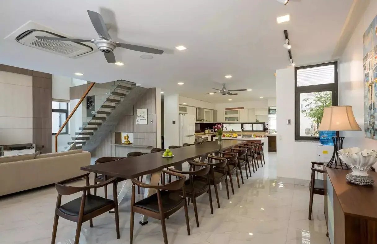 Large kitchen and long dining table in a Da Nang villa for group meals
