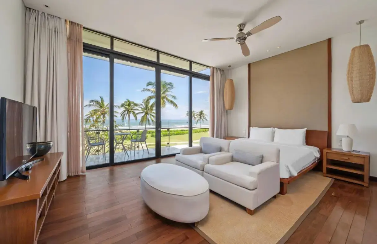 Enjoying morning coffee with a serene view from the balcony of a Da Nang luxury villa.
